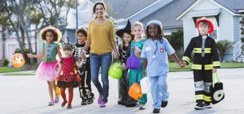 Wearing reflective clothing, chaperoning young children, and following street safety are important ways to stay safe while trick-or-treating.