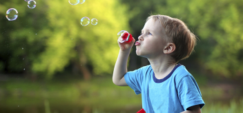Child Blowing Bubbles
