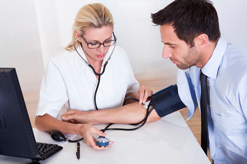 nurse checks blood pressure