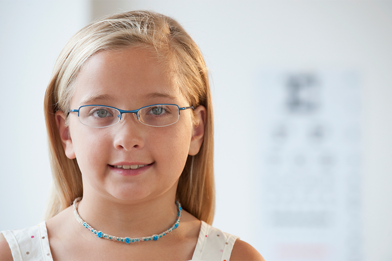 young girl wearing glasses