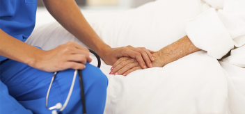 nurse holding hands with patient