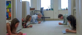 Members of the UPMC marketing department do the plank challenge