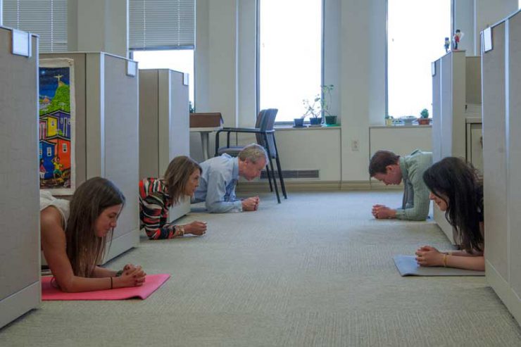 Members of the UPMC marketing department do the plank challenge