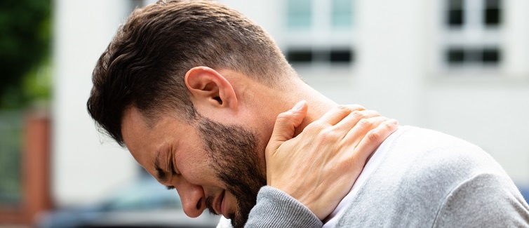 Young Man Having Pain In His Neck