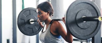 woman working out with a barbell
