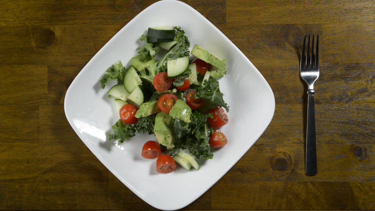 Learn how to make an avocado cucumber salad with this video guide.