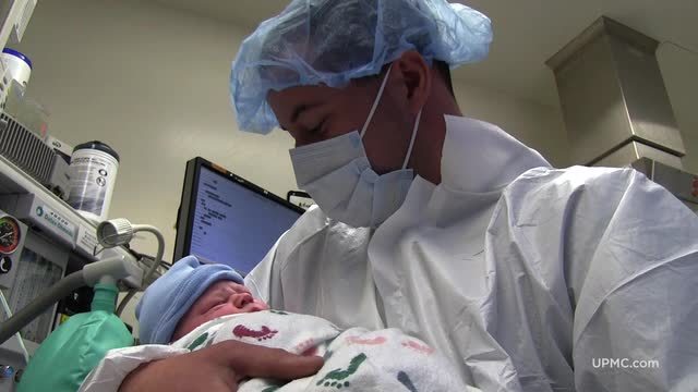 Dr. Carey Andrew-Jaja of Magee-Womens Hospital of UPMC welcomes newborn babies into the world with a beautiful song.