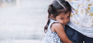 little girl hugging her mother